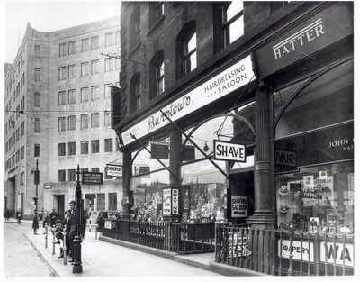 Barstows Barbershop on Wellington Street, Leeds, 1939 by English Photographer